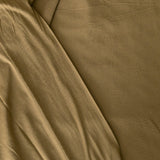 Close-up of forest green jersey knit fabric with visible texture