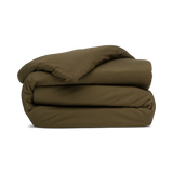 A folded duvet cover in forest green, with a zipper and corner ties visible.