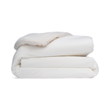 Stack of white blankets on a white background