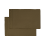 A pair of forest green jersey knit pillowcases with a hem png flat lay image