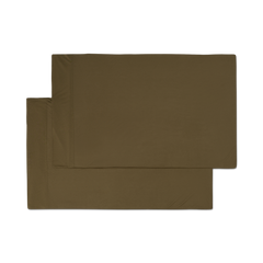 A pair of forest green jersey knit pillowcases with a hem png flat lay image