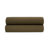 two green pillow shams folded on top of each other