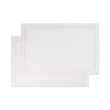 A set of flat lay white jersey knit sham pillowcases.