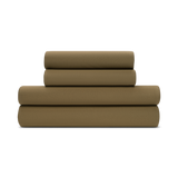 A folded forest green jersey knit sheet set on a plain background.