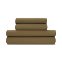 A folded forest green jersey knit sheet set on a plain background.
